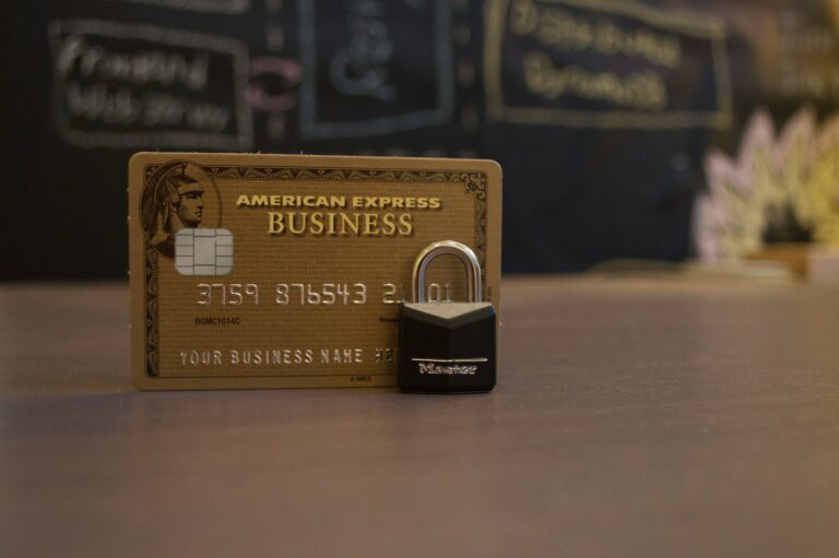 Gold American Express card with padlock next to it.